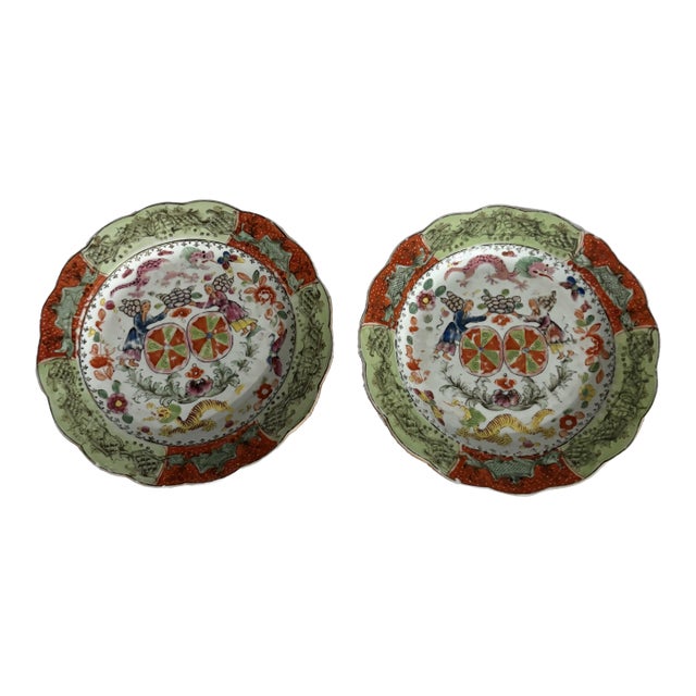 Elegant and impressive pair of 18th century English Worcester plates. With scalloped shaped rims and hand painted vibrant...