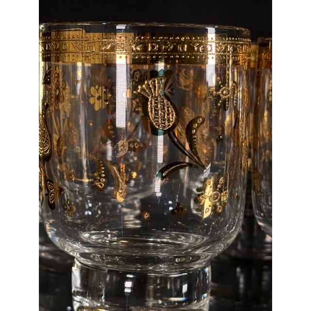 The Chantilly pattern by Culver features an all-over scattering of gold paisley, floral, and botanical motifs beneath a...