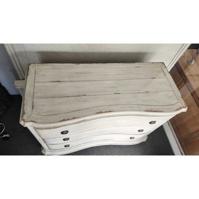 Add graceful storage to your space with this brown bowfront chest featuring elegant curves and timeless design. Three...