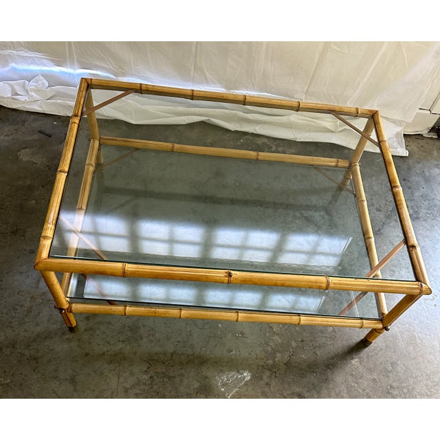 Vintage Bamboo, Glass, and Brass Coffee Table. Has a corresponding table on the bottom.