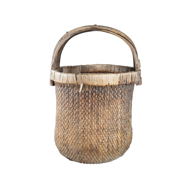 Early 20th Century Chinese Rice Basket. Made from woven reed with a bentwood handle and calligraphy. Dimensions: 16" x 16"...