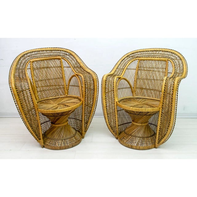 This pair of wicker armchairs were produced in the 1970s by the famous French company Kok Maison, and advertised in a...