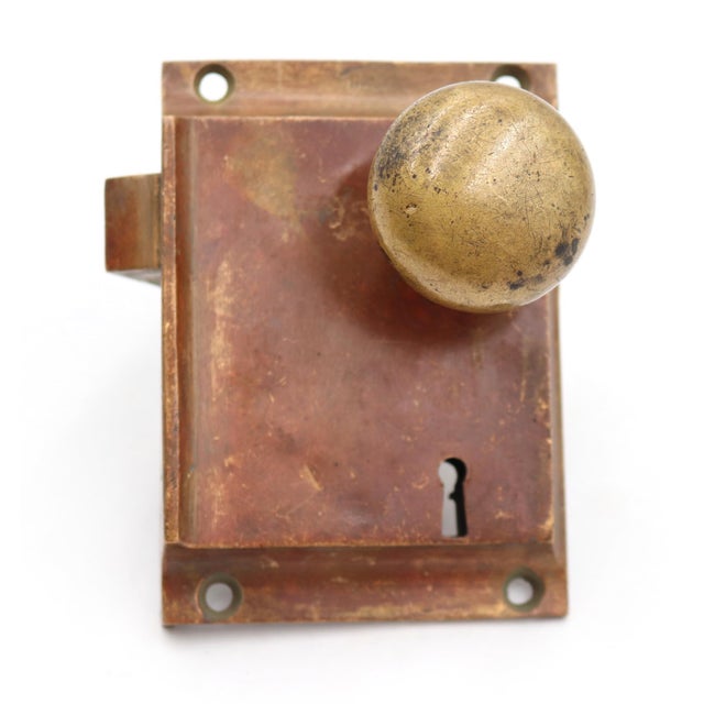 Antique rim lock door lock set with plain round door knobs. The lock is made by Norwalk. Good condition with appropriate...