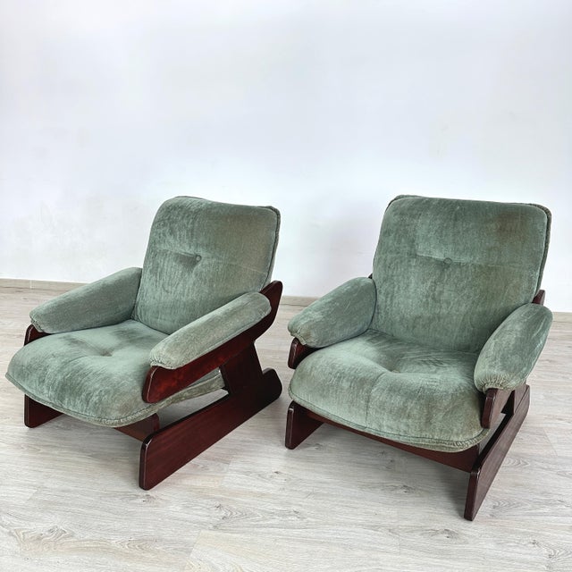 Dimensions: H 34” x W 33” x D 34” x SH 16” Pair of Italian Brutalist lounge chairs with dark wood frames and light...
