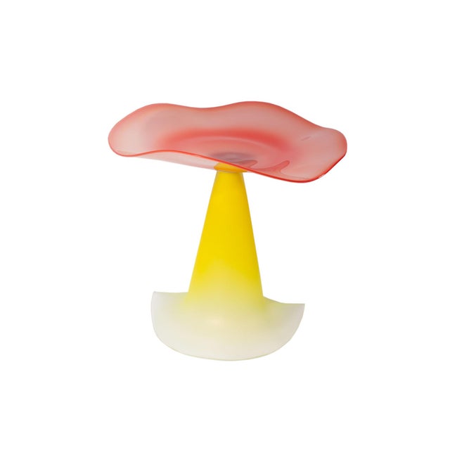 A 2001 art glass compote by the American glass artist Stephan Cox (born 1956). This delicate work features a red-pink...