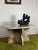This three-part Vintage Postmodern coffee table pairs a uniquely shaped rectangular top with a genius two-piece cross-...