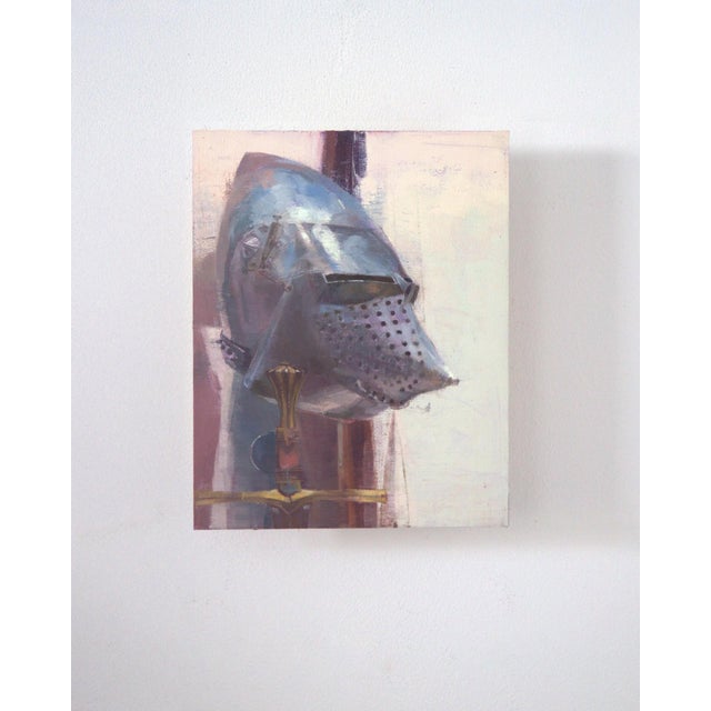 This oil painting presents a striking still life featuring a gleaming helmet alongside a sword, evoking a sense of...