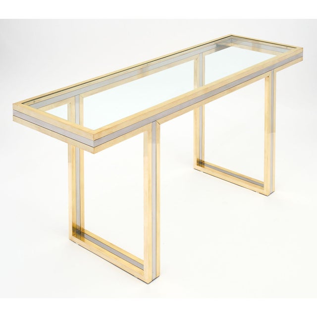Romeo Rega signed console table made of brass and chromed steel. We love the square sectioned lines and the strong...