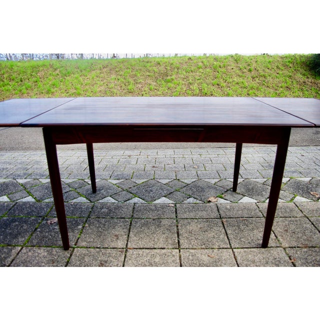 Large Scandinavian dining table designed by Arne Vodder for Sibast with a beautiful flamed vintage finish. The table has...