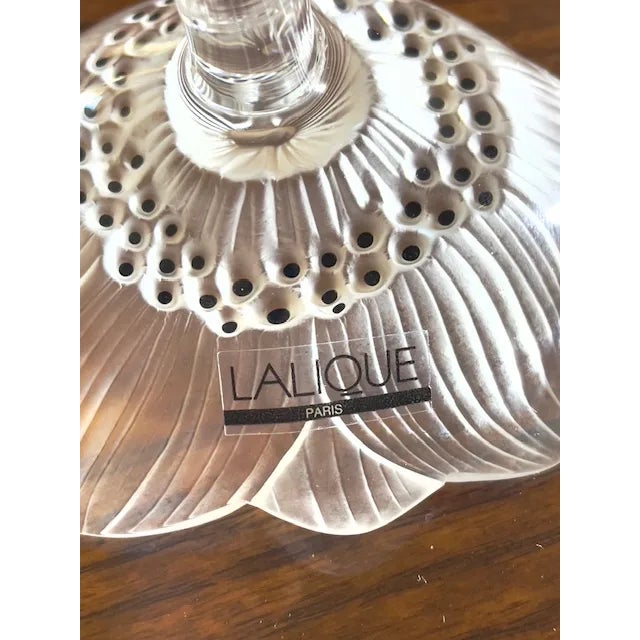 The Lalique France Crystal sculptured features a delicate 4-1/4" ANEMONE FLOWER with STEM design, crafted by artist Rene...