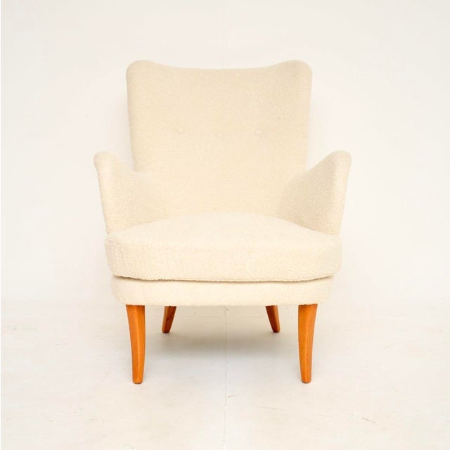 A stylish and extremely comfortable vintage Swedish armchair by Carl Malmsten. This model is very rare, it is called the...