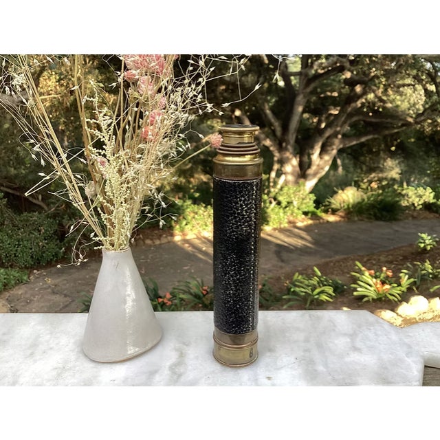 A vintage French nautical telescope with black pebbled leather stitched leather cover. French manufacture of the second...