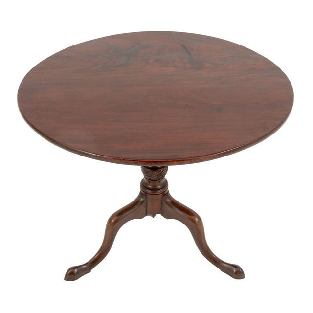 George III Mahogany Tripod Table, with tilt top above columnar stem atop three cabriole legs. Top flipped: 46" H x 33"...