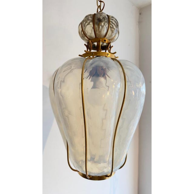 Mid-20th century pendant lamp, manufactured by Barovier & Toso, Murano, Italy, 1960s. The chandelier consists of an...