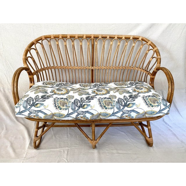 Original mid-century French bamboo and rattan settee with traditional lines characteristic of Franco Albini. Moderately...
