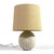 This exceptional table lamp has a hand made ceramic base in an onion shape with vertical incised lines. The original shade...
