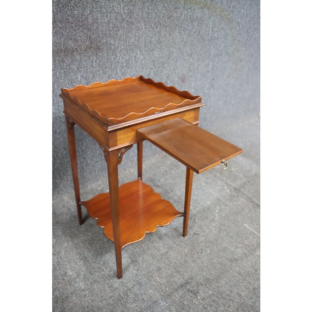 Westing, Evans & Egmore candle stand with scalloped edge trim and pull out candle tray.