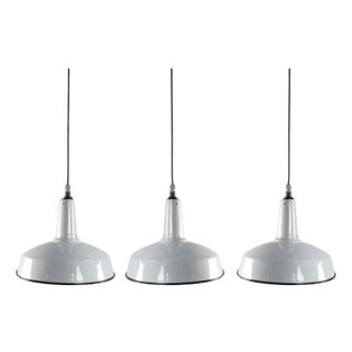 1960s White Enamel and Cast Iron Industrial set of three Pendant Lights - Set of 3 For Sale