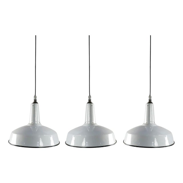 1960s White Enamel and Cast Iron Industrial set of three Pendant Lights - Set of 3 For Sale