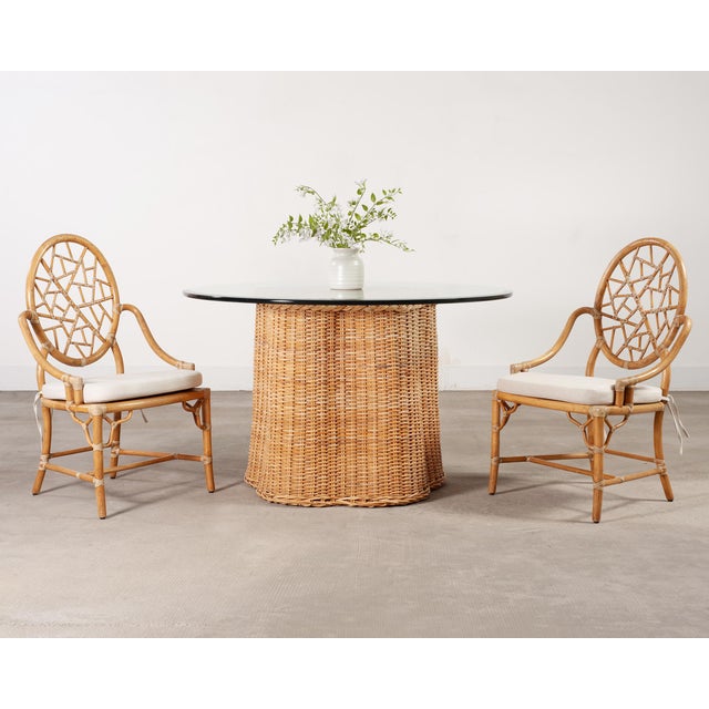 A natural late 20th century organic modern rattan wicker dining table or center table from the estate of late California...