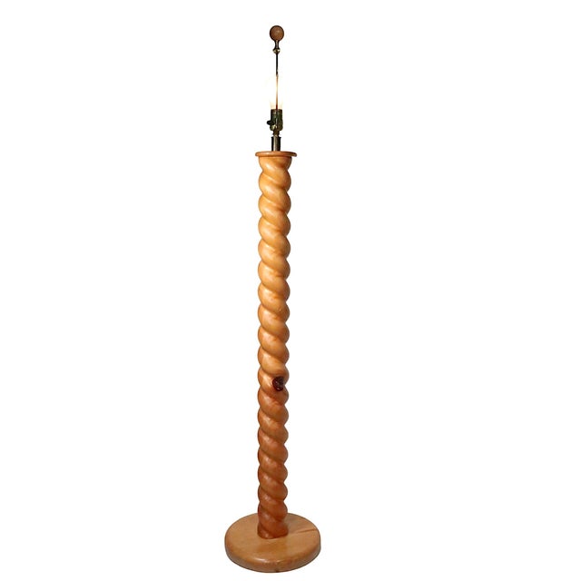 Unusual modernist version of the classic Barley Twist form, floor lamp executed in pine, with original pleated shade. This...