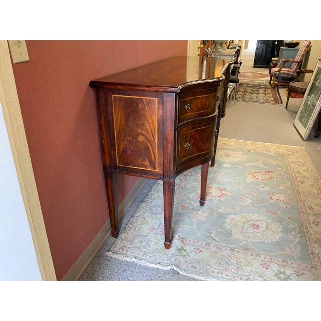 Late 20th Century Empire Craftsman Hepplewhite style inlaid mahogany sideboard. A late 20th Century high quality...