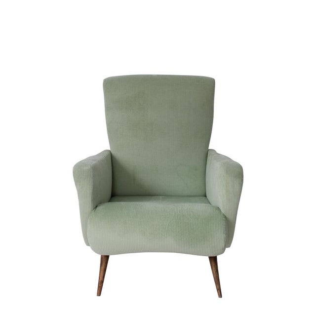 Elegant Italian reclining armchair from the 1950s, upholstered in aqua green ribbed fabric. The piece features a high...