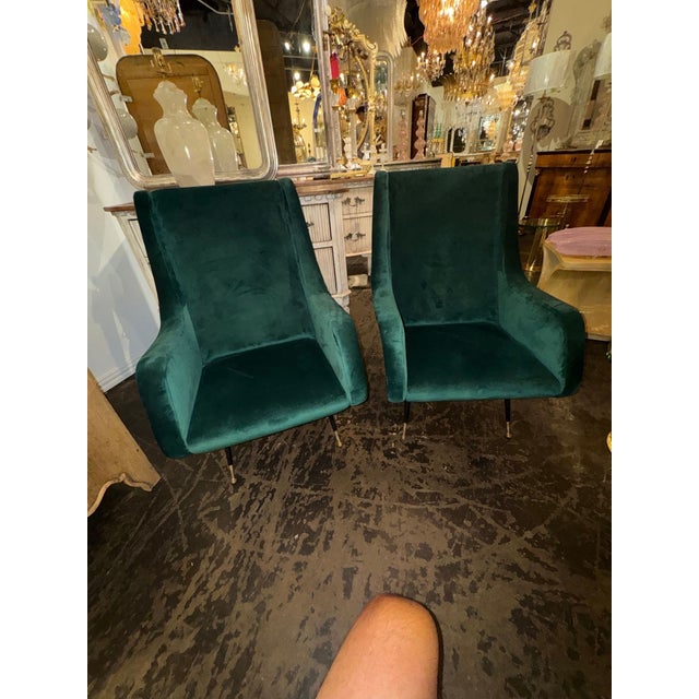 The product is a stylish pair of Italian Marco Zanuso Manner club chairs. These chairs are known for their sleek design...