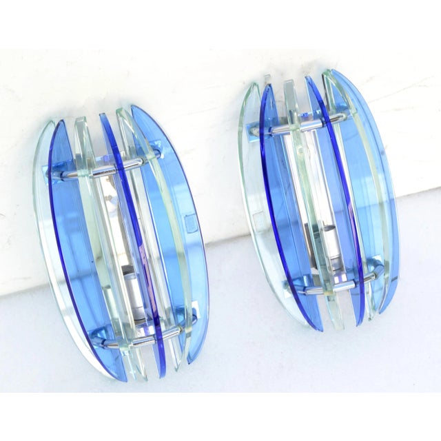 Superb pair of blue and clear glass blades Sconces by Veca. We have 2 pair available, priced by pair. US rewired and each...