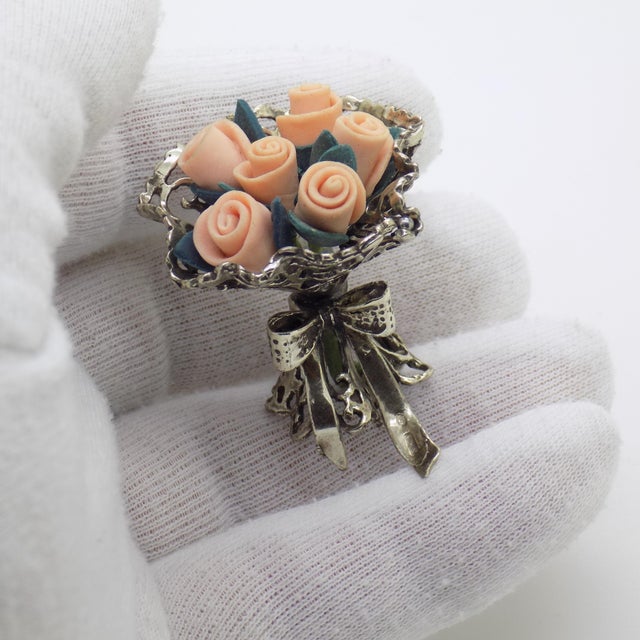 A decorative vintage miniature depicting a flower bouquet with roses, handmade in Arezzo, Tuscany, Italy between the 1980s...