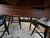 Vintage L Hitchcock cloverleaf drop leaf table with harvest finish. Has two additional leaves. Comes with eight chairs....