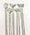 A whimsical set of five vintage stainless steel cocktail picks topped with miniature figural motifs including a cow, pig,...