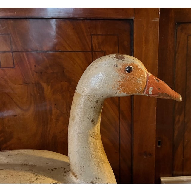 Antique carved wood & paint decorated snow goose waterfowl bird decoy circa 1920. Features include orange red beak, glass...