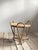 A distinctive handcrafted rattan side table made in Japan, most likely during the 1970s. The design is defined by three...