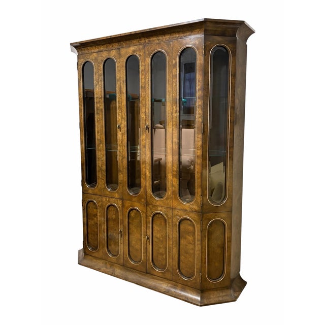 Mastercraft William Doezema burled amboyna wood display cabinet, 1970s. Beveled glass, brass detail and hardware, and...