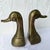 A charming pair of vintage Mid-Century brass duck bookends featuring clean sculptural lines and stylized forms...
