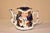 19th century Toby tea pot from the Staffordshire region of England. The top is in a scalloped shape and is a brilliant...