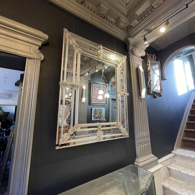 Elegant mirror with engraved glass panels from the Italian manufacturer Barovier & Toso in Murano. Frame composed of...