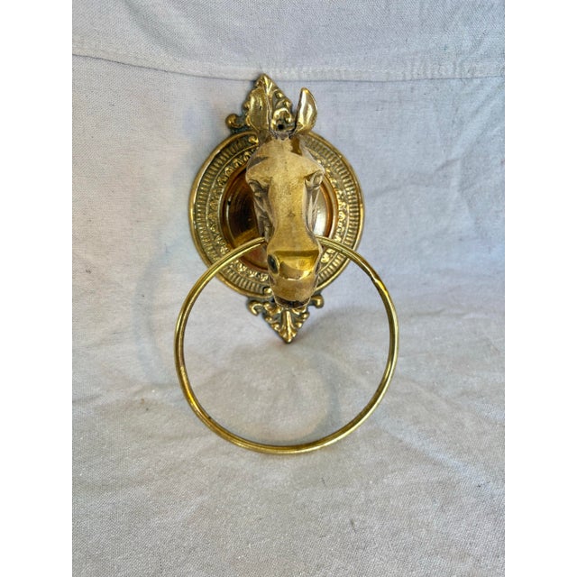 This Mid 20th Century Horse Head Towel Ring was crafted from brass in the mid 1900's. The piece features a horse head...