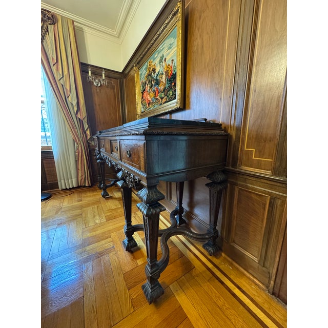 This buffet server is very heavy, very old, and very well-made. Has minor damage on one of the front swirls. Has been used...