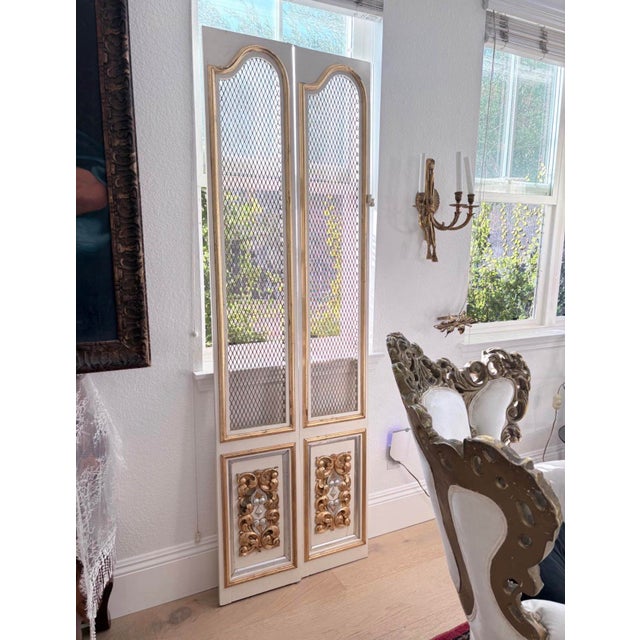 Striking set of four tall vintage architectural panels featuring slender wood frames, diamond-pattern metal mesh inserts,...