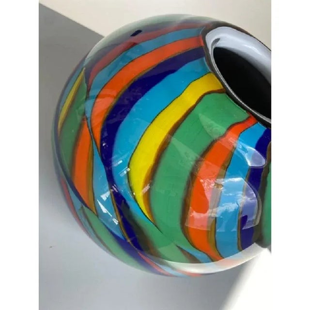 Spectaculer lively Vase in Murano Glass with Multicolored Reeds.The colored glass rods are melted into the milky white...
