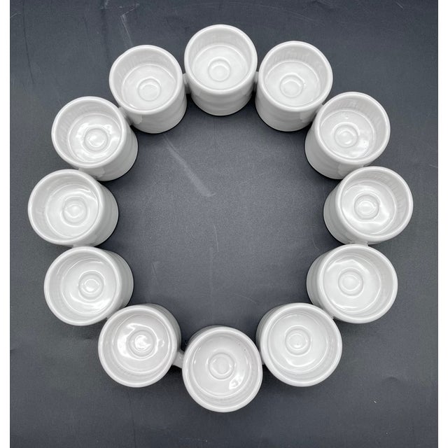 An exceptional, curated ensemble of 12 modular porcelain objects from the "Ehlen" series, designed by renowned Swedish...