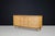 A striking Belgian Brutalist sideboard crafted in oak during the 1970s, featuring an exceptional façade of deeply carved...