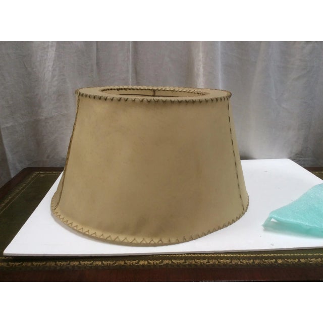 Great looking antique vellum shade with hand stitched details. Minor stains and shade variation. The inner wire diameter...