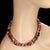 This elegant 33‑inch rhodonite smooth nugget necklace is a beautiful blend of natural color and refined craftsmanship....
