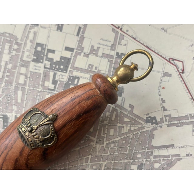 A fabulous vintage Italian regency brass and wood bottle opener with a lovely aged patina. Marked "Italy" on reverse....