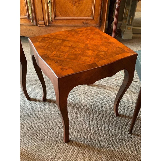 A pair of elegant Italian tables, vintage 1950's with inlaid tops and cabriolet legs. Both marked made in Italy.