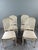 Set of four chairs in molded and carved wood, resting on fluted, tapered legs. The backs are caned, and the seats are...