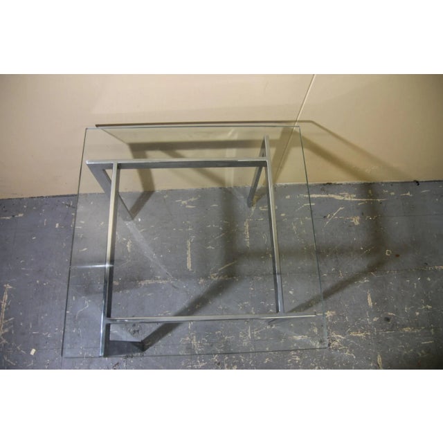 Nice chrome and glass coffee table that can be used as a small coffee table or side table. This table is in the manner of...